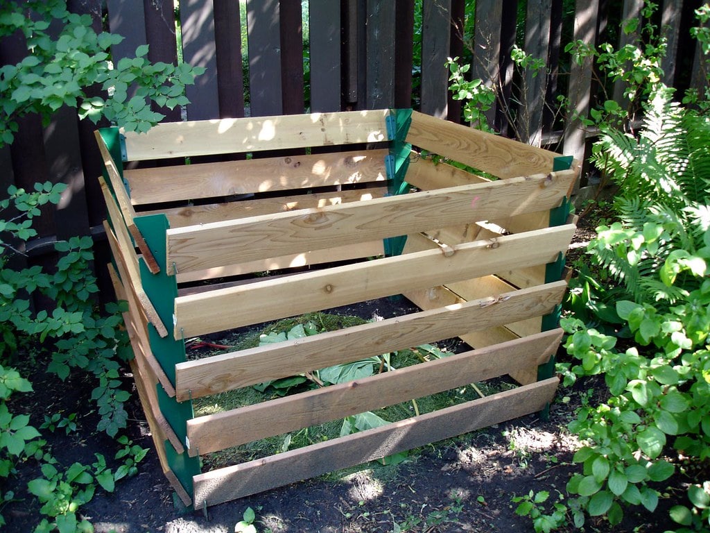 Image of a large wood slat bin that can be used for compost