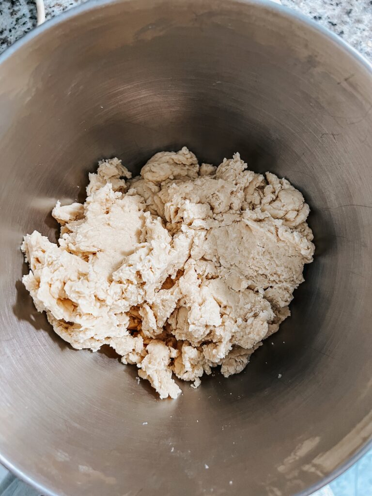 Overhead shot of the sourdough cinnamon roll dough before kneading, as the dough was hydrating. It's somewhat shaggy, but still holding together well.